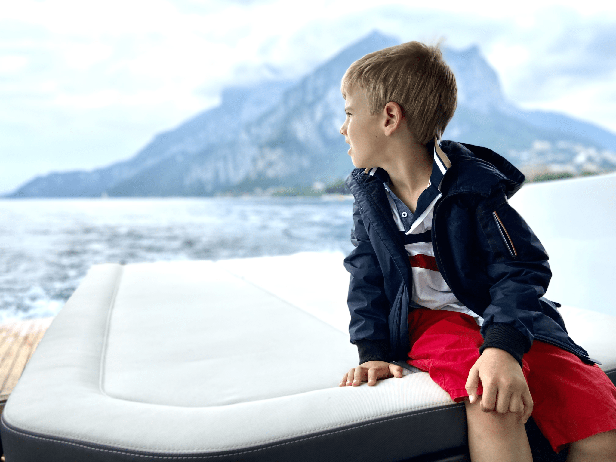 Family holiday on lake como with happy child on limotender during a como private boat tour near Bellagio
